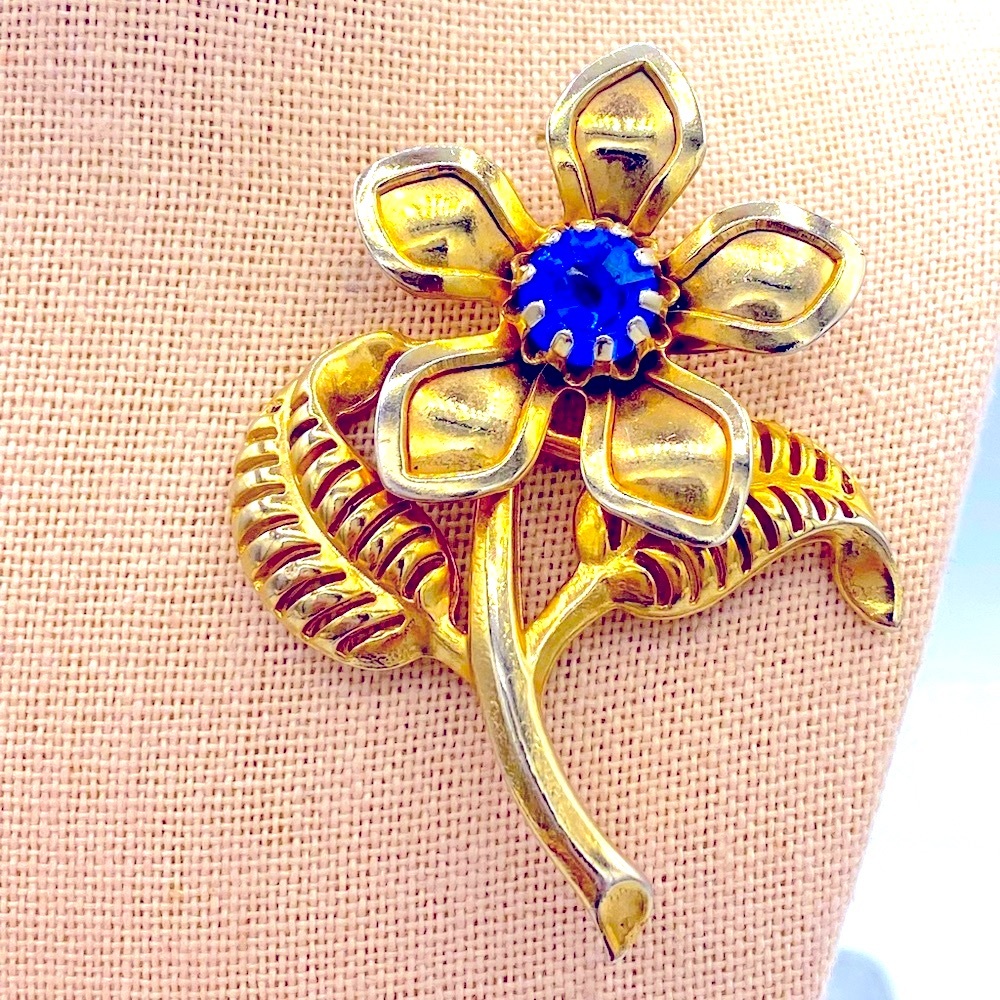 Vintage Gold Tone Floral Brooch Royal Blue Rhinestone Center Textured Leaves